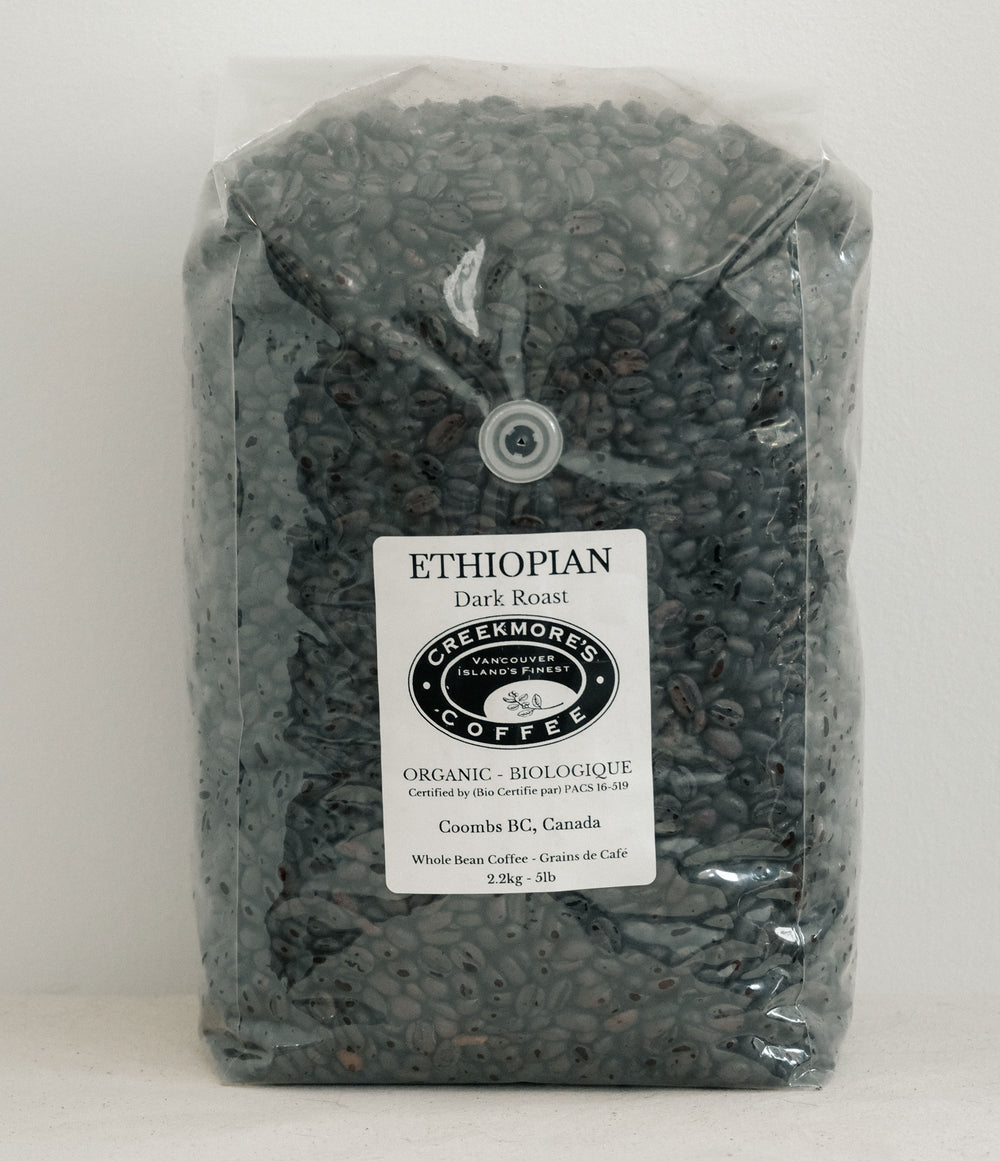 A 3 lb bag of Greekmores Coffee Ethiopian Dark Roast whole bean coffee in a clear plastic bag with a white label, set against a plain white background.