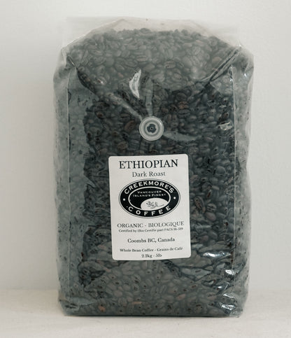 A 3 lb bag of Greekmores Coffee Ethiopian Dark Roast whole bean coffee in a clear plastic bag with a white label, set against a plain white background.