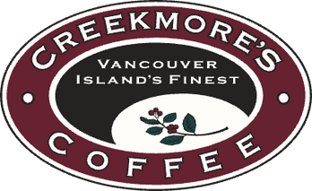 Creekmore's Coffee logo featuring a maroon oval with white text reading 'CREEKMORE'S COFFEE' and 'Vancouver Island's Finest' in a black center section with a white lower section and a small coffee plant illustration.