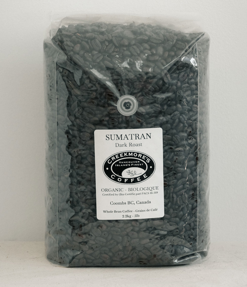 A 3 kg bag of Creekmore's Coffee Sumatran Dark Roast whole bean coffee in a clear plastic bag with a white label, set against a plain light background.