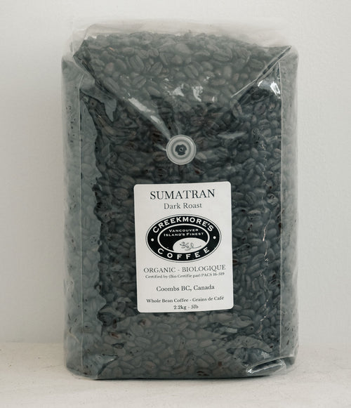 A 3 kg bag of Creekmore's Coffee Sumatran Dark Roast whole bean coffee in a clear plastic bag with a white label, set against a plain light background.